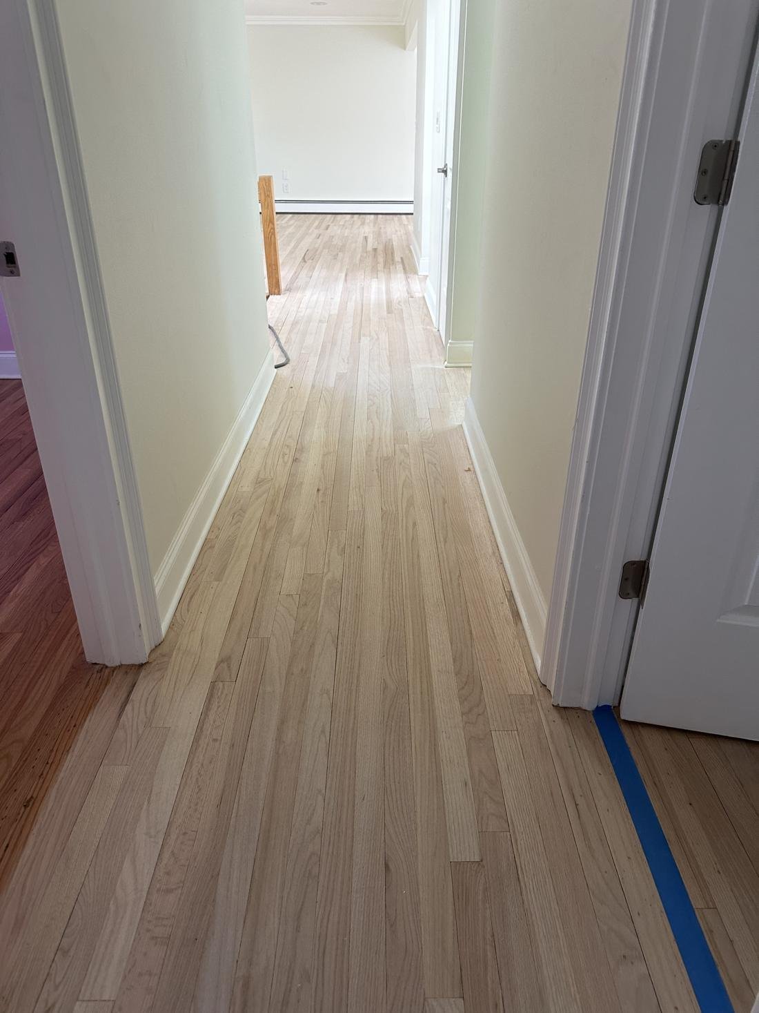 Hallway oak floor sanded down to bare wood